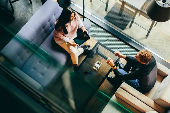 Young couple chatting at table