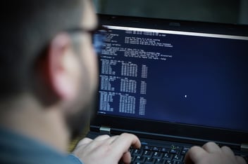 Man at computer carrying out penetration test